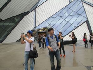 People taking pictures of cyclists