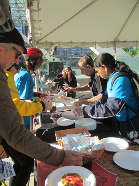 Volunteers distribute breakfast