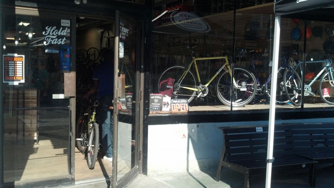 A cyclist enters the bike shop
