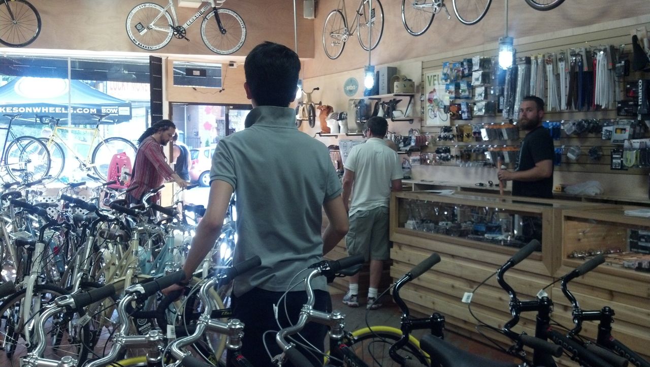 Patrons and staff inside shop