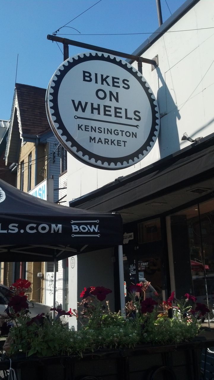 Large round sign outside shop