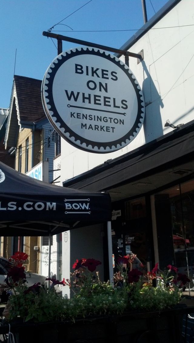 Large round sign outside shop